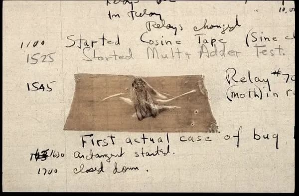 The 1947 Mark II logbook page with the moth taped in